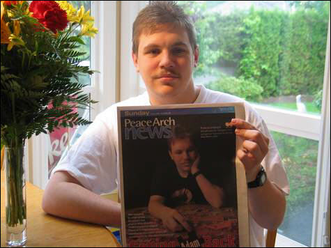 Adam Martell, Proudly Displays the Newspaper Article That Talks About His Success